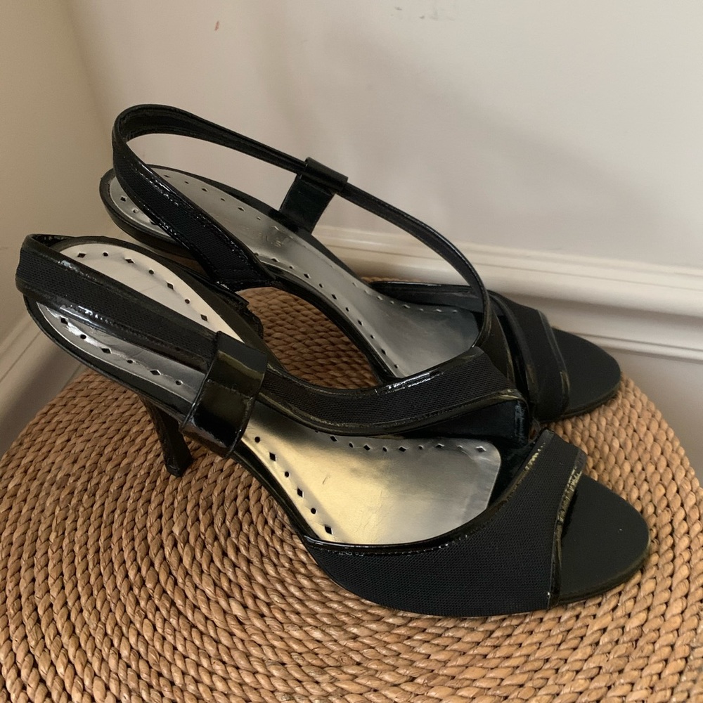 Black strappy high heel sandals.